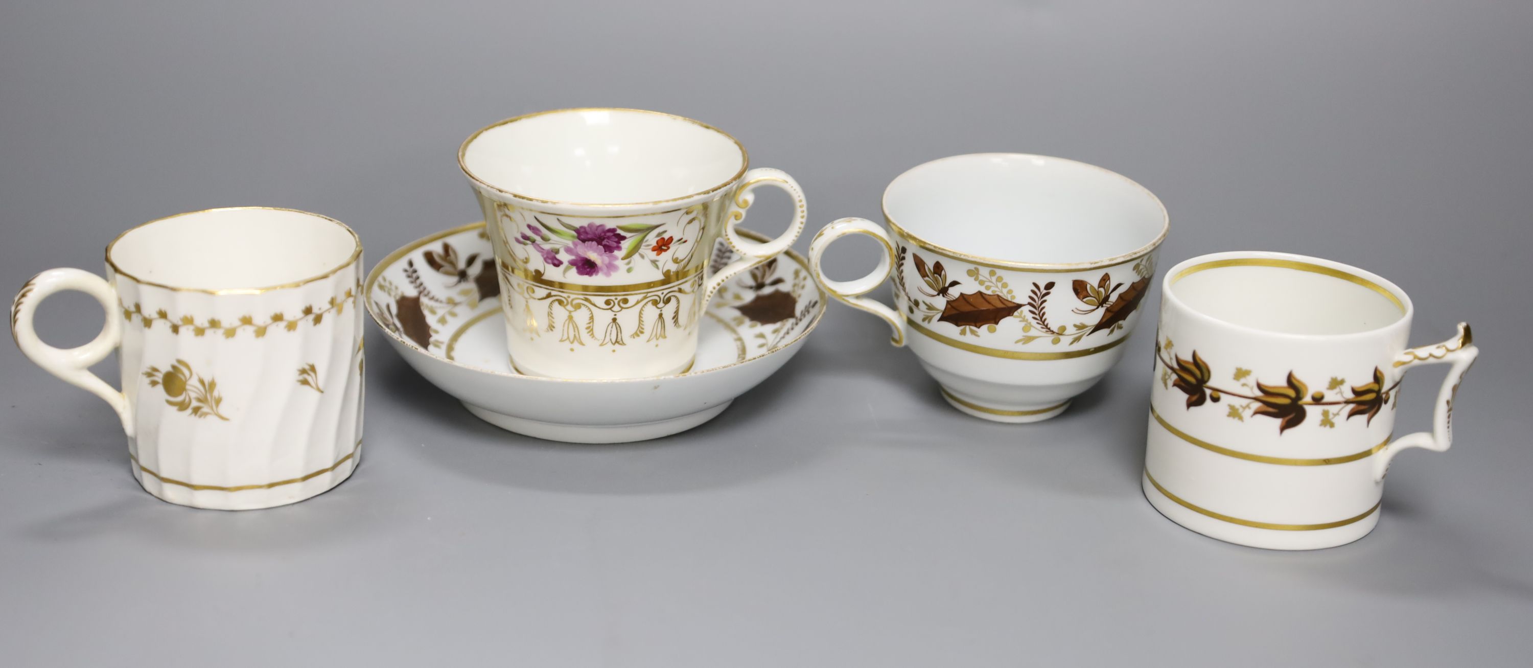 An early 19th century Worcester teacup and saucer painted with brown leaves with a landing insect, incised B, a Worcester coffee can